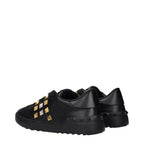 Black leather Valentino Garavani sneakers with sleek design and white sole, showcasing their stylish and premium craftsmanship.