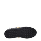 Valentino Garavani black leather sneakers with sleek design and white rubber soles, stylish footwear for casual wear.