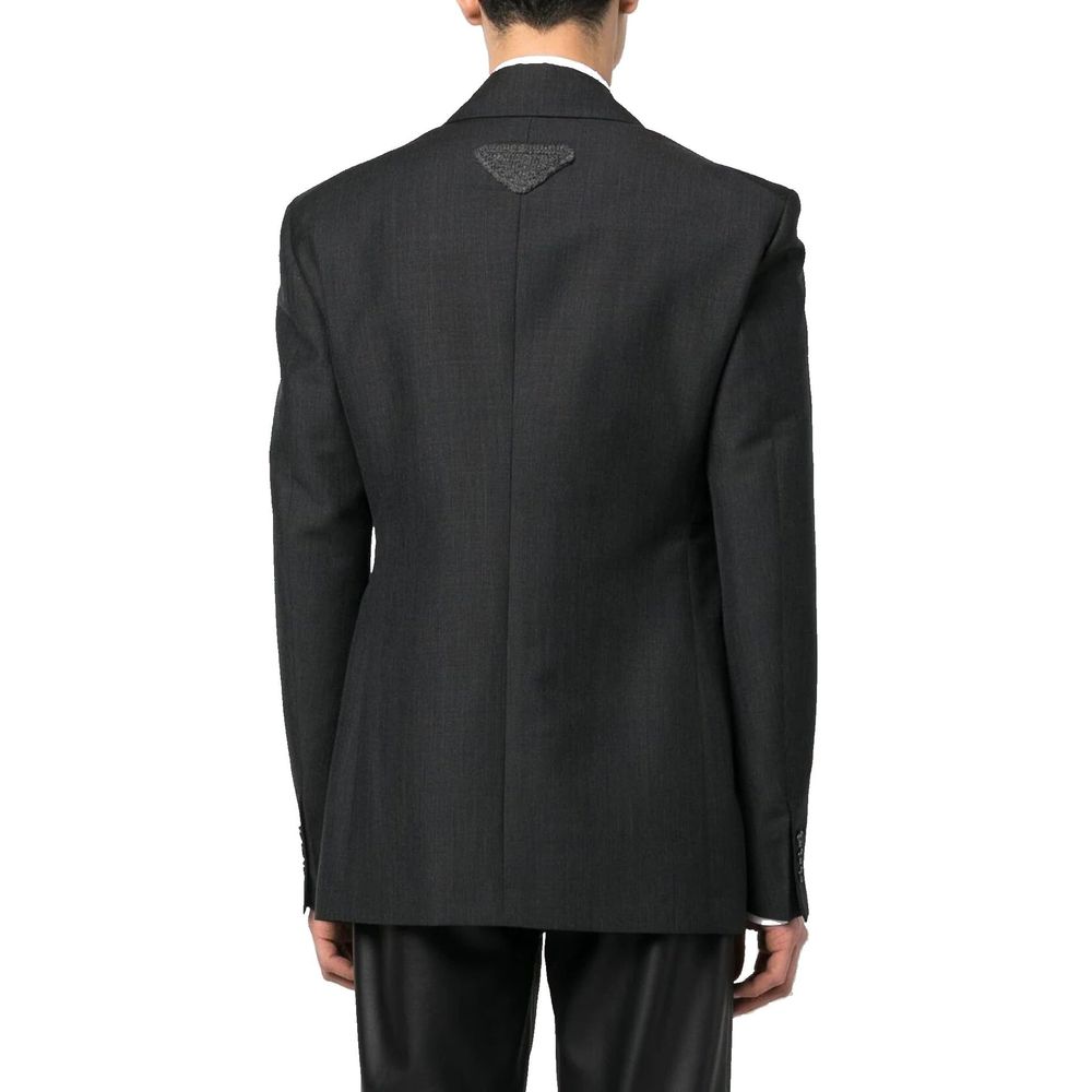 Prada gray wool blazer with tailored fit, notched lapels, and button front, displayed on a hanger.