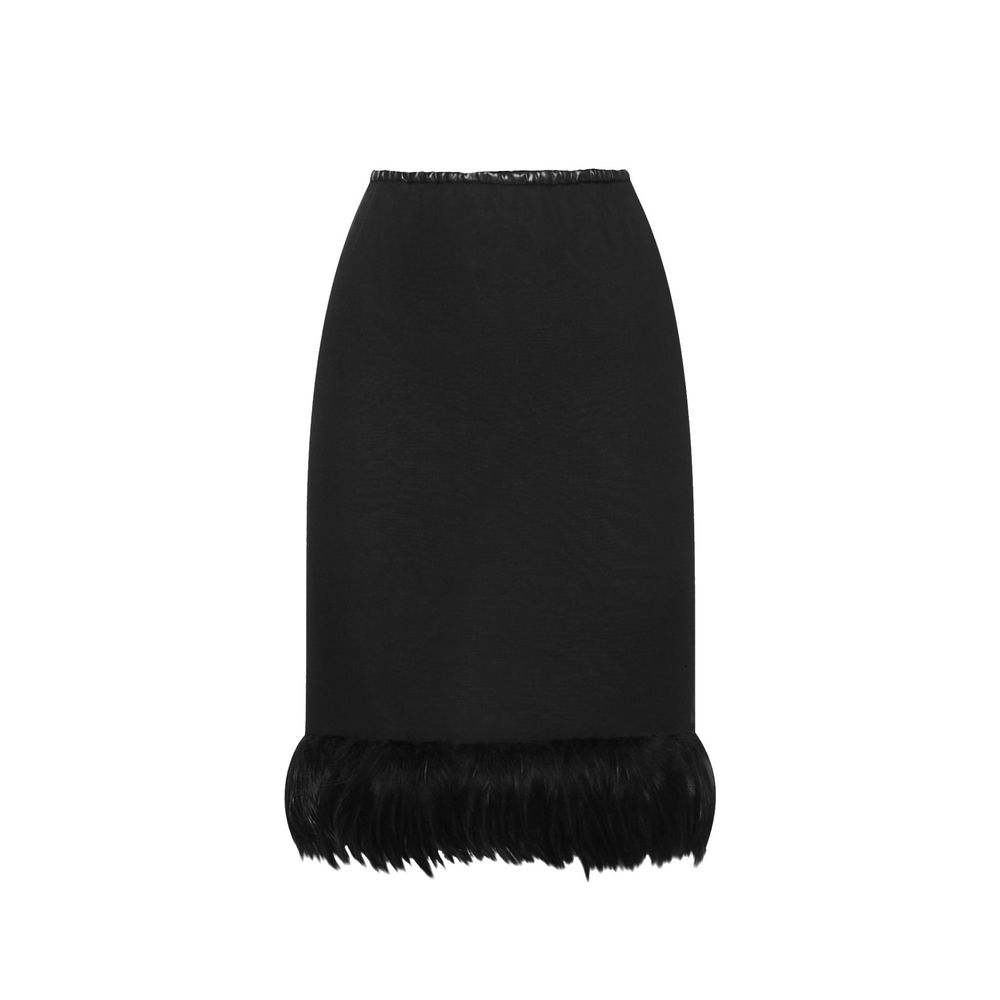 Black silk skirt by Saint Laurent with a sleek, elegant design and a high waist, shown on a model.