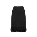 Black silk skirt by Saint Laurent with a sleek, elegant design and a high waist, shown on a model.