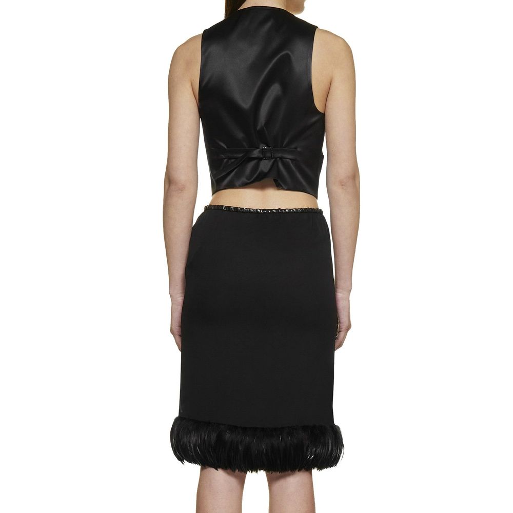 Black silk skirt by Saint Laurent, showcasing a sleek, elegant design with smooth fabric and a high-waist fit.