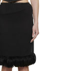Black silk skirt by Saint Laurent with a sleek, elegant design, featuring a high waist and flowing silhouette.