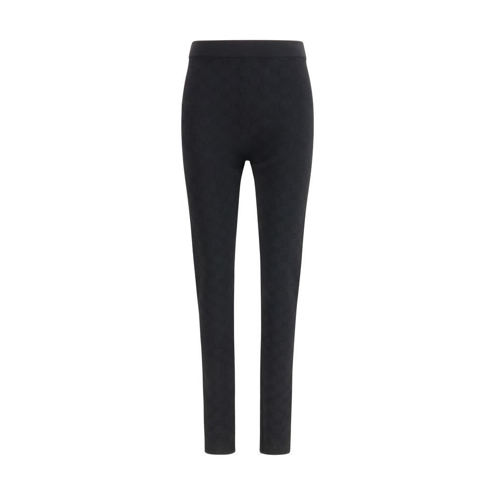 Gucci black viscose leggings displayed on a model, showcasing the sleek fit and smooth fabric.
