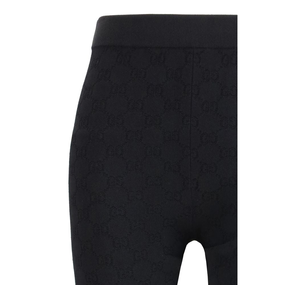 Gucci black viscose leggings with a smooth, fitted design and subtle sheen, styled on a model.