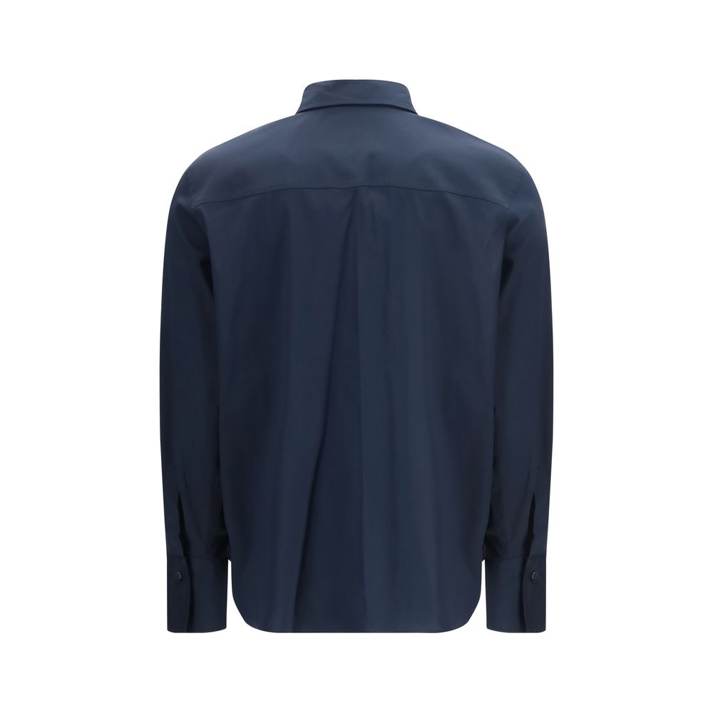 Brunello Cucinelli blue cotton dress shirt displayed flat, featuring a classic collar and button-down front.