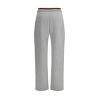 Gray Gucci cotton casual pants displayed on a hanger, featuring a relaxed fit and subtle branding details.