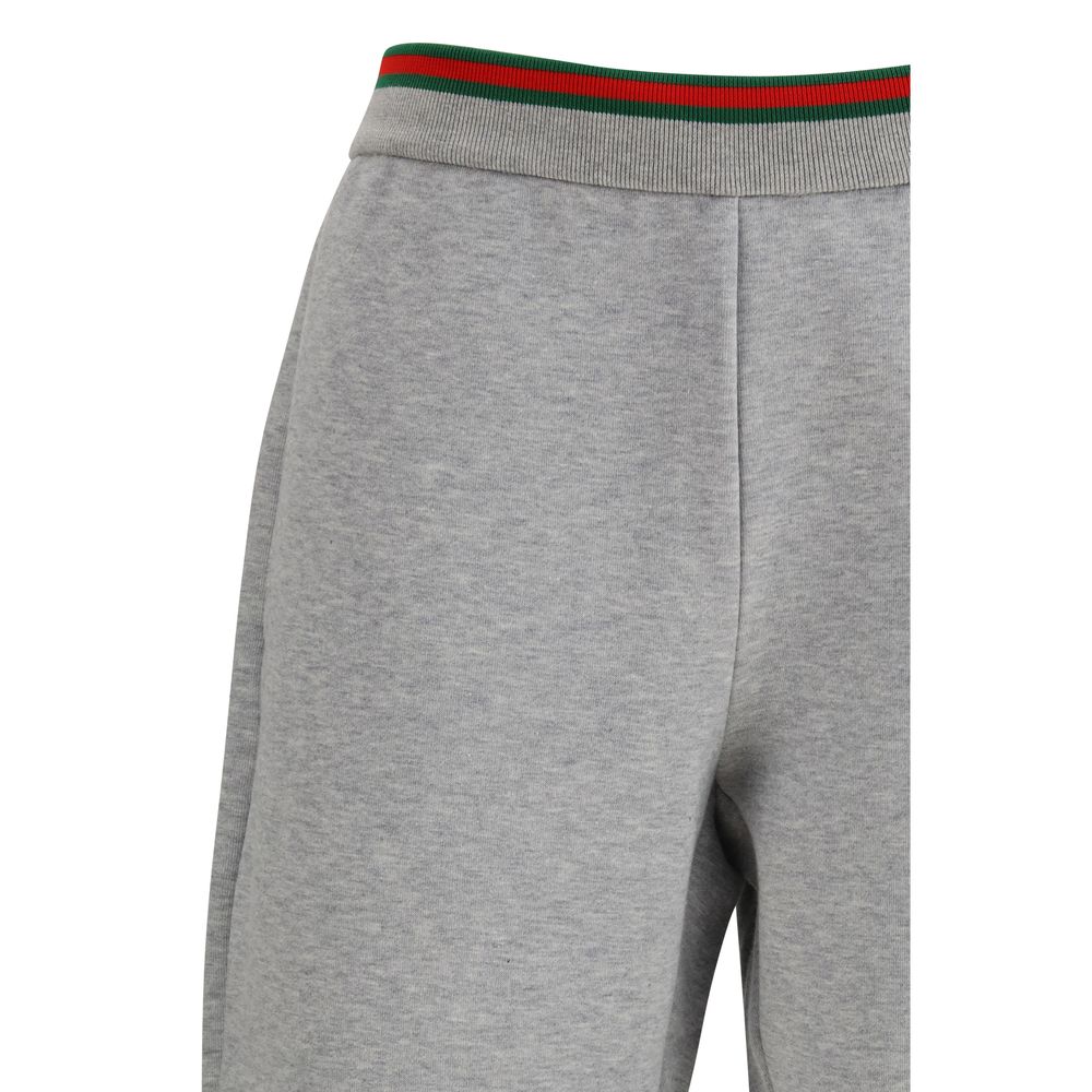 Gucci gray cotton casual pants with a relaxed fit and subtle branding, displayed on a neutral background.