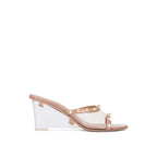 Beige leather Valentino Garavani mules with pointed toes and sleek design, perfect for stylish, sophisticated footwear.