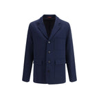 Gucci blue cotton full-length jacket hanging on a clothing rack, showcasing its stylish design and tailored fit.