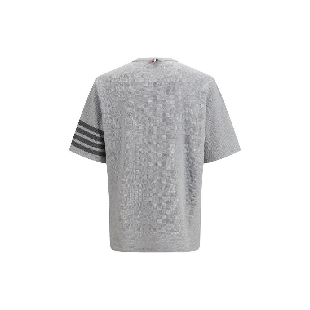 Thom Browne gray cotton sportswear garment with a classic fit and minimalist design, displayed on a plain background.