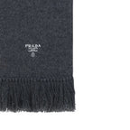 Prada gray cashmere scarf draped over a neutral background, showcasing soft fabric and elegant, luxurious texture.