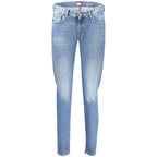Tommy Hilfiger blue cotton women's slim jeans shown on a model with front pockets and a classic five-pocket design.