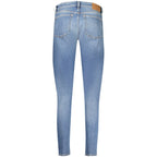 Tommy Hilfiger blue cotton women's slim jeans displayed on a model, showcasing modern fit and classic denim style.