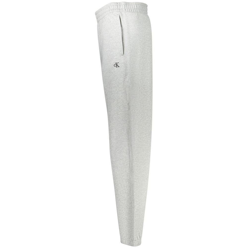 Calvin Klein Grigio cotton men's sport trousers, slim fit with side pockets, casual and comfortable for everyday wear.