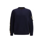 Sacai blue cotton sweatshirt with a relaxed fit, featuring a crew neckline and ribbed cuffs, styled casually on a model.