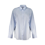 Guess Jeans azzurro cotton women's shirt displayed with a relaxed fit and button-down front featuring the Guess logo.