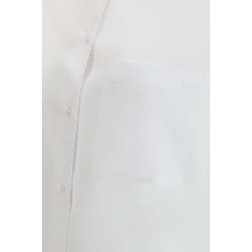 Loulou De Saison white cotton dress shirt with classic collar and button-front, neatly folded for display.