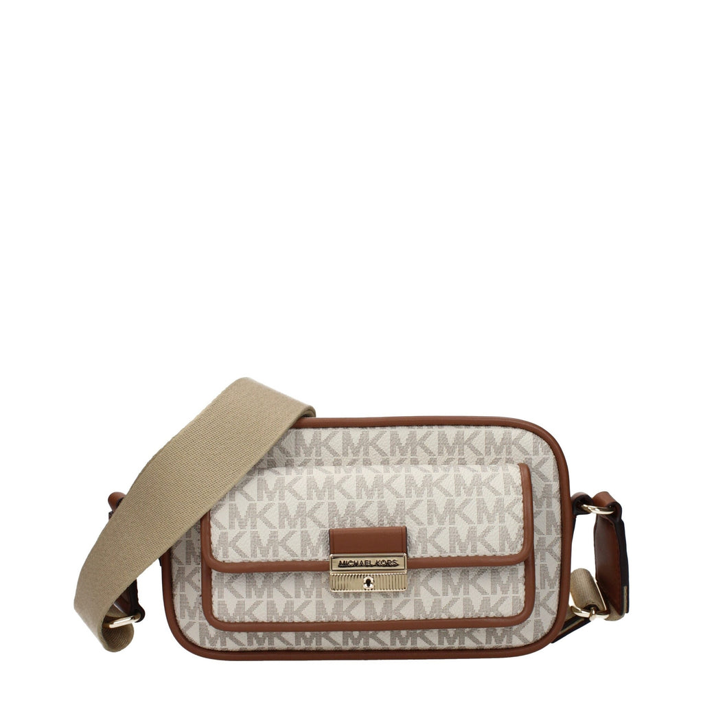 Michael Kors beige fabric crossbody bag with adjustable strap and gold-tone hardware on a plain background.
