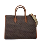 Michael Kors brown fabric handbag with top handles and zip closure, showcasing a stylish and versatile accessory for everyday use.