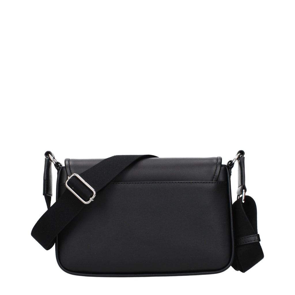 Black leather Michael Kors crossbody bag with adjustable strap and gold-tone hardware, featuring a sleek, compact design.