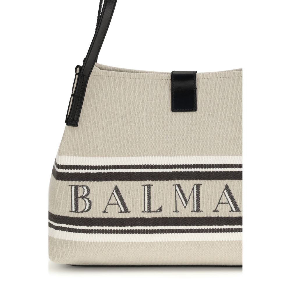 Balmain beige cotton shoulder bag with strap and subtle branding details, ideal for casual or chic outfits.