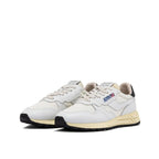 White leather Autry athletic sneakers with lace-up design and cushioned soles, ideal for sports and casual wear.