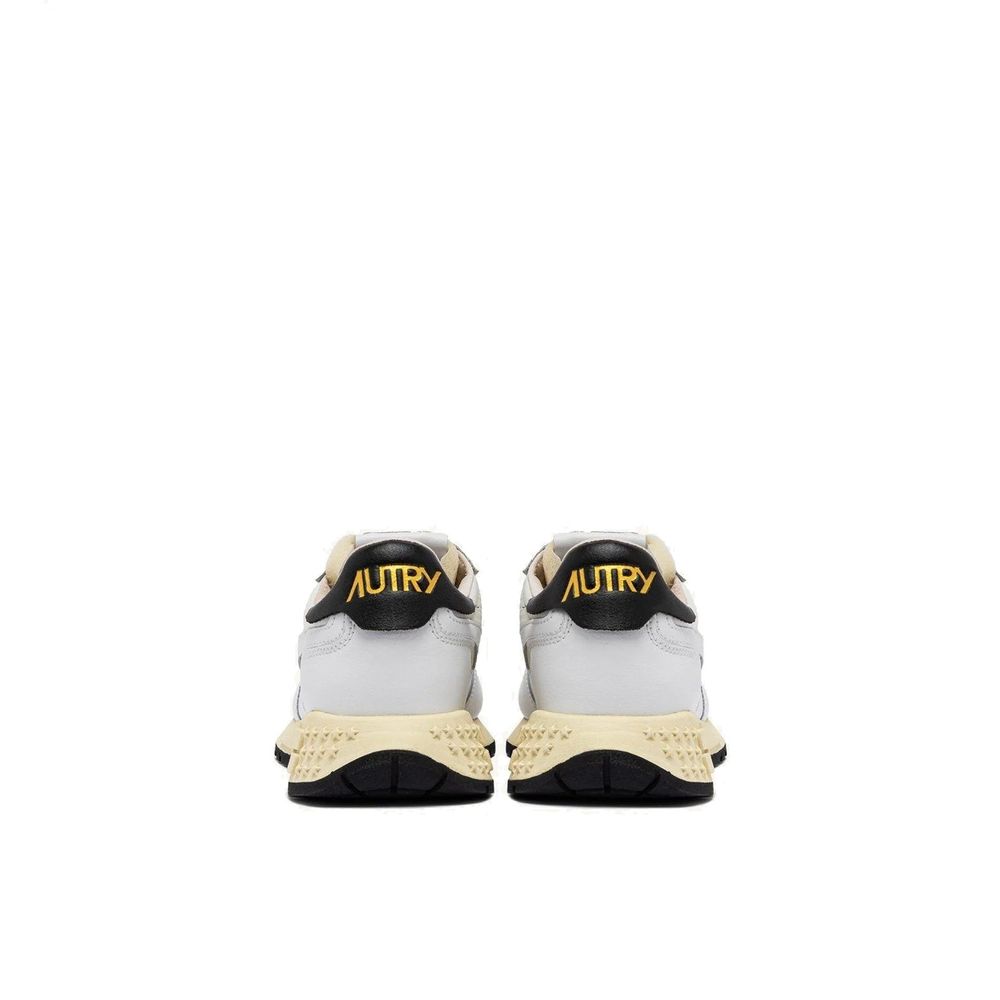 Autry white leather athletic sneakers with lace-up design and cushioned soles, ideal for casual and sportswear.