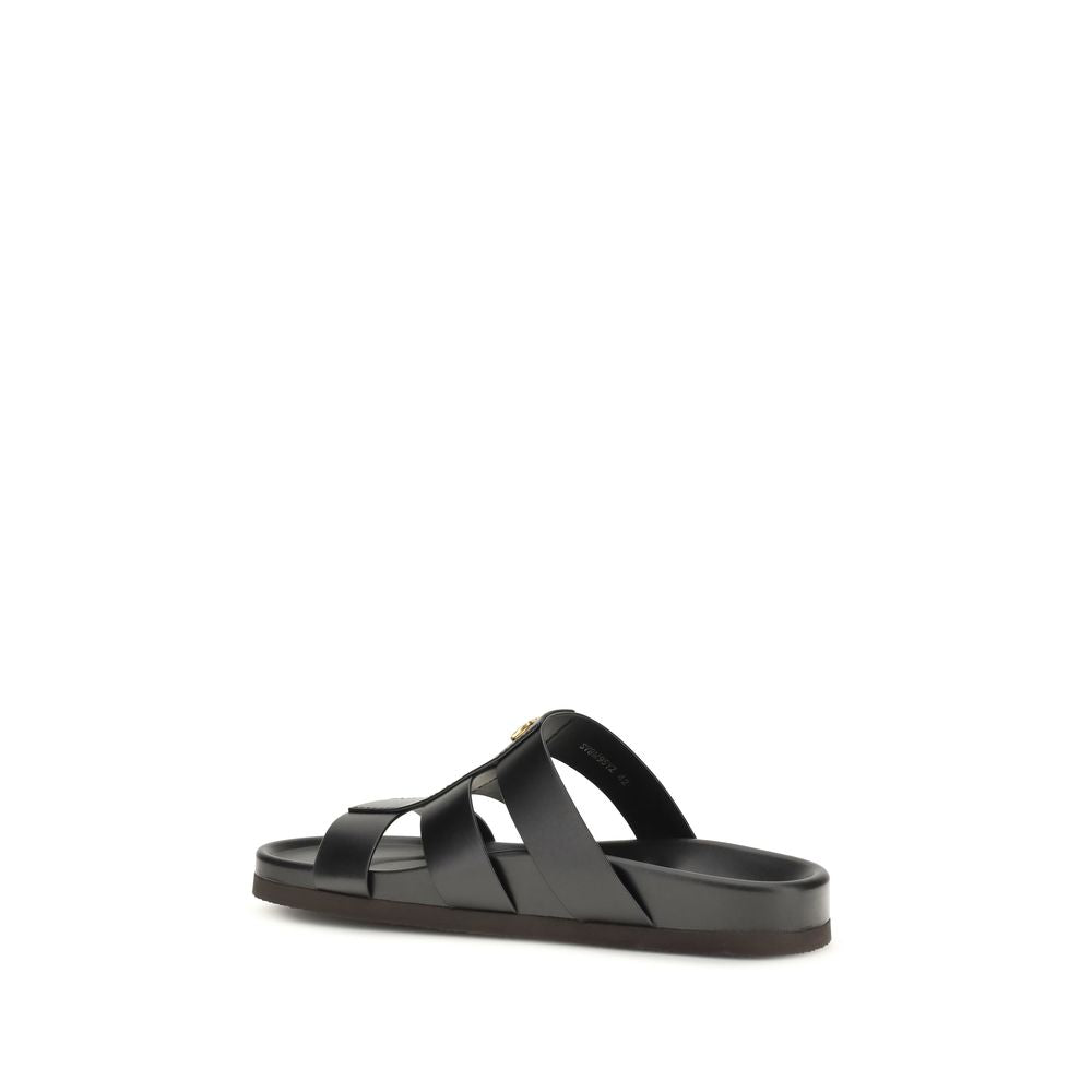 Black calf leather Valentino Garavani Bos Taurus sandals with open toes and ankle straps, stylish and luxurious footwear.