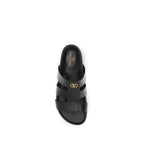 Valentino Garavani black calf leather Bos Taurus sandals with open toe and ankle strap, stylish and elegant footwear.