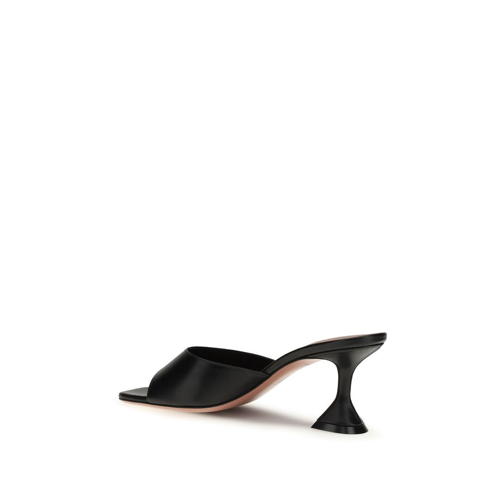 Amina Muaddi black lamb leather stiletto heel sandals with sleek straps and pointed toes, stylish and elegant footwear.
