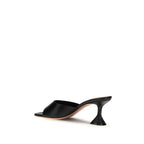 Amina Muaddi black lamb leather stiletto heel sandals with sleek straps and pointed toes, stylish and elegant footwear.