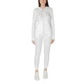 EA7 Emporio Armani cream polyester tracksuit laid flat, showing the full front view with logo details and smooth fabric texture.