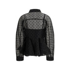 Ganni black recycled polyester patterned shirt with long sleeves and a relaxed fit, displayed on a hanger.