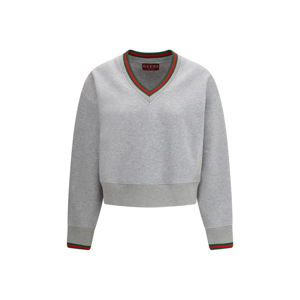 Gray Gucci cotton sweatshirt with relaxed fit and subtle branding, displayed on a hanger against a plain background.