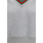 Gray cotton Gucci sweatshirt with logo detail, displayed on a hanger against a plain background.