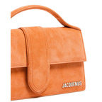 Jacquemus Terracotta Leather Le Grand Bambino Handbag with top handle and minimalist design on a neutral background