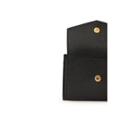 Saint Laurent Bos Taurus wallet in black calf leather with sleek design and subtle branding, shown open with card slots visible.