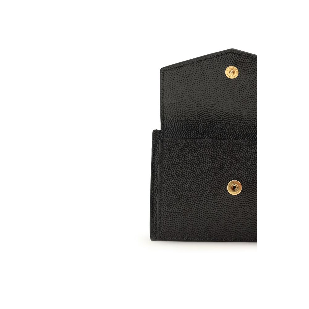 Saint Laurent Bos Taurus wallet in black calf leather with sleek design and subtle branding, shown open with card slots visible.