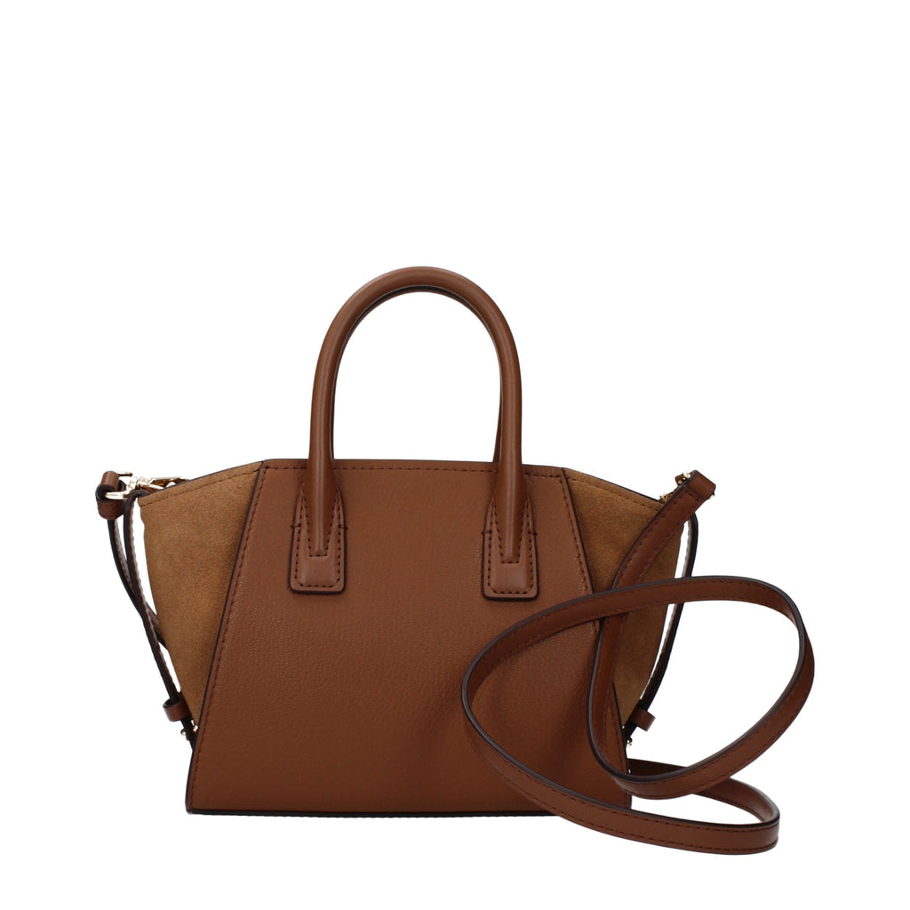Brown leather handbag by Michael Kors with gold-tone hardware and structured design, featuring top handles and a spacious interior.