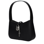Black leather Michael Kors handbag with gold accents and structured design, featuring double top handles and a sleek, stylish appearance.