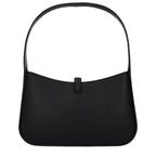 Black leather Michael Kors handbag with gold-tone hardware and structured design, showcasing a spacious interior and elegant style.