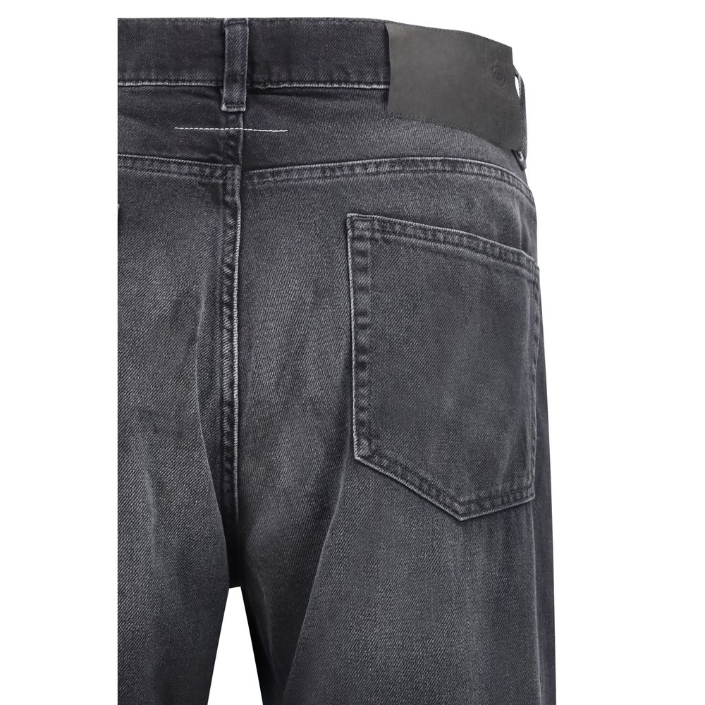 MM6 black cotton straight-leg jeans displayed on a hanger with a minimalist background.