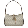 Michael Kors gold fabric handbag with structured design and top handles, showcasing elegant style and craftsmanship.