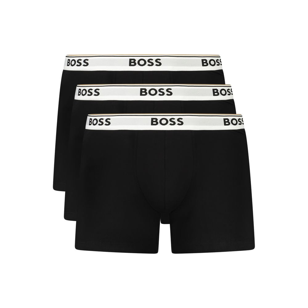 Hugo Boss black cotton men's boxer briefs with a comfortable fit and elastic waistband, close-up of fabric and design.