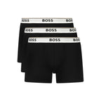 Hugo Boss black cotton men's boxer briefs with a comfortable fit and elastic waistband, close-up of fabric and design.