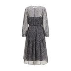 Max Mara black silk casual dress displayed on a hanger, showcasing its elegant fabric and simple, stylish design.