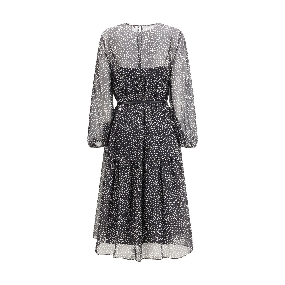 Max Mara black silk casual dress displayed on a hanger, showcasing its elegant fabric and simple, stylish design.