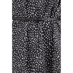 Max Mara black silk casual dress displayed on a hanger, showcasing its elegant, smooth fabric and simple, stylish design.