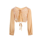 Kristina Ti orange silk blouse featuring a relaxed fit and elegant drape, showcased on a mannequin.